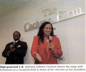 High-powered L.A. attorney Johnnie Cochran shares the stage with Nobumoto at a reception held in honor of her election as bar president.