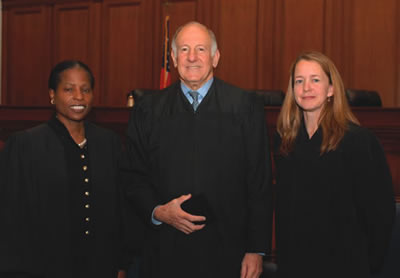 Joann Remke (right) was sworn in as presiding judge of the State Bar Court by Chief Justice Ronald George and Pat McElroy (left) was sworn in for another term as hearing judge.