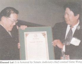 Elwood Lui (l) is honored by Senate Judiciary chief counsel Gene Wong