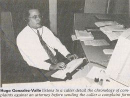 Hugo Gonzalez-Valle listens to a caller detail the chronology of complaints against an attorney before sending the caller a complaint form