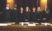 Alyson Locher (center) poses with the other Supreme Court justices in the YMCA's model court program.