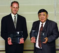 Jeffrey Wortman, co-president 
      of the Lesbian and Gay Lawyers of Los Angeles (L) and U.S. District Judge 
      Robert M. Takasugi, hold their awards